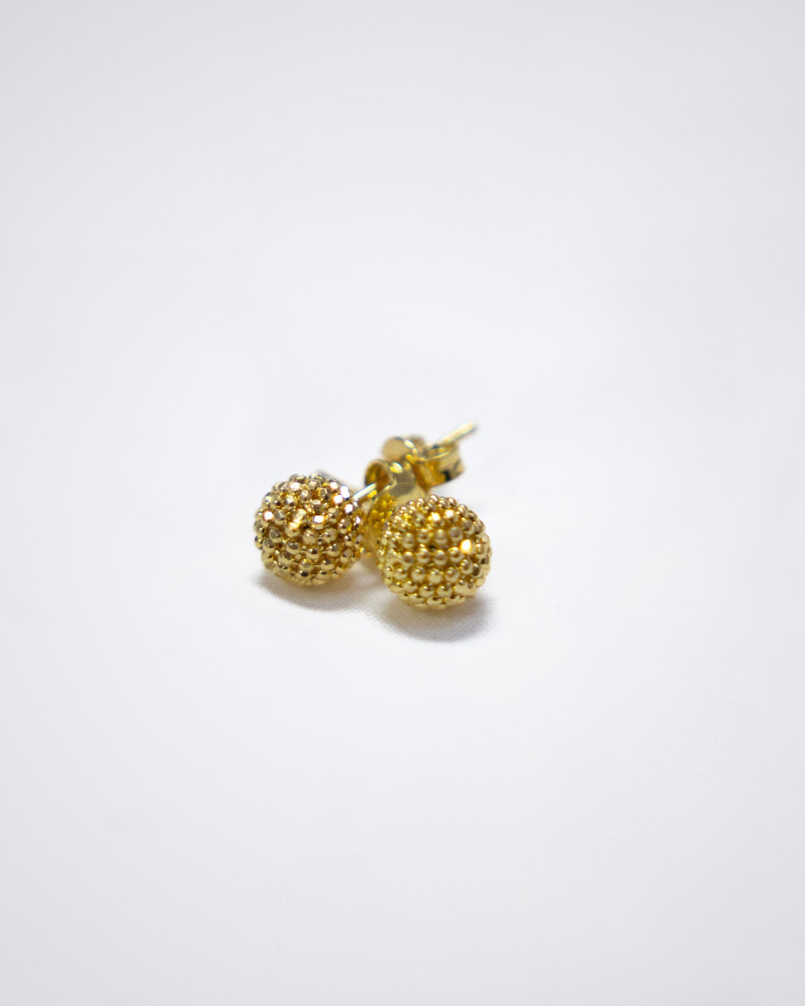Dazzling yellow gold studs